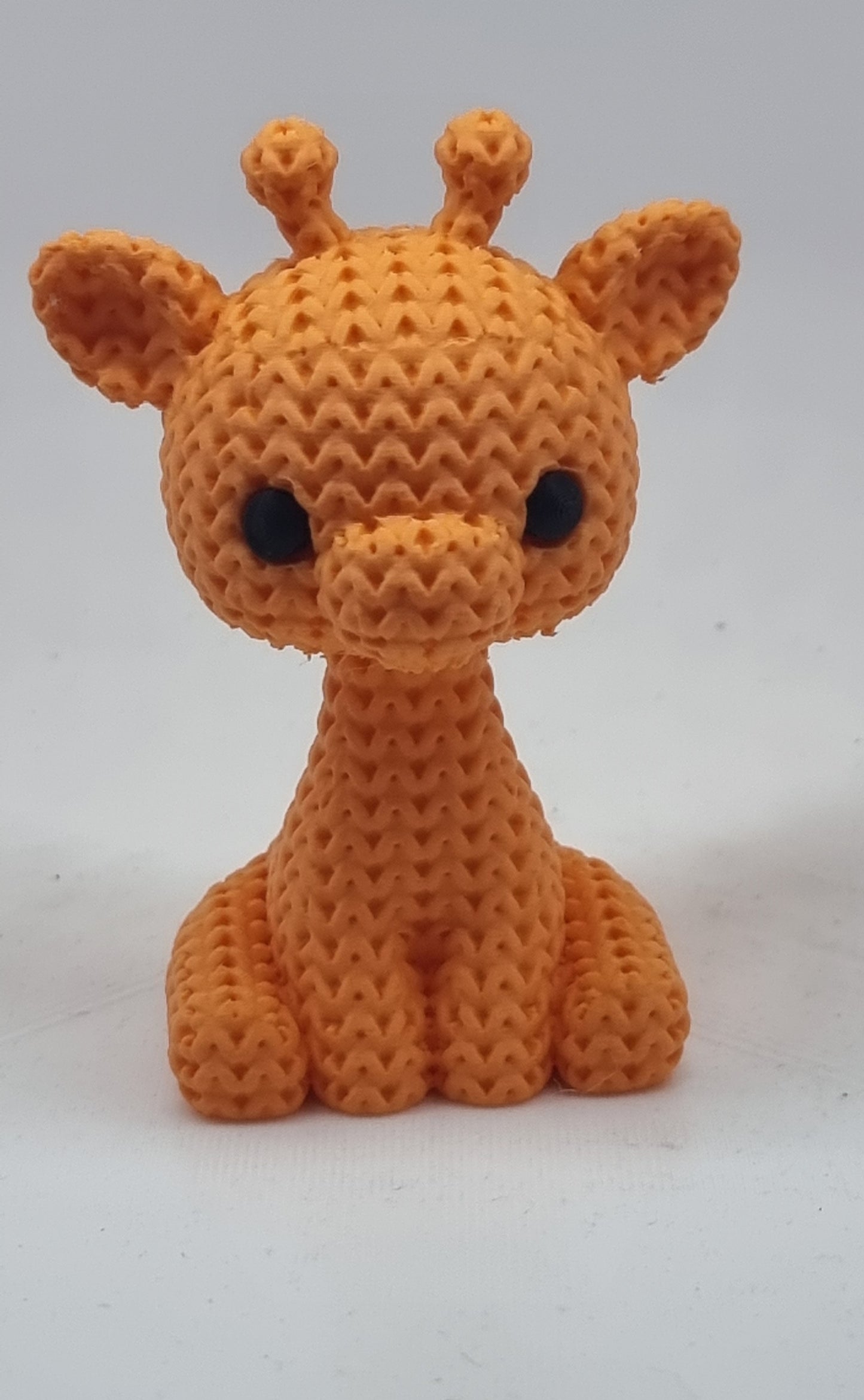 Giraffa  con trama ad uncinetto.